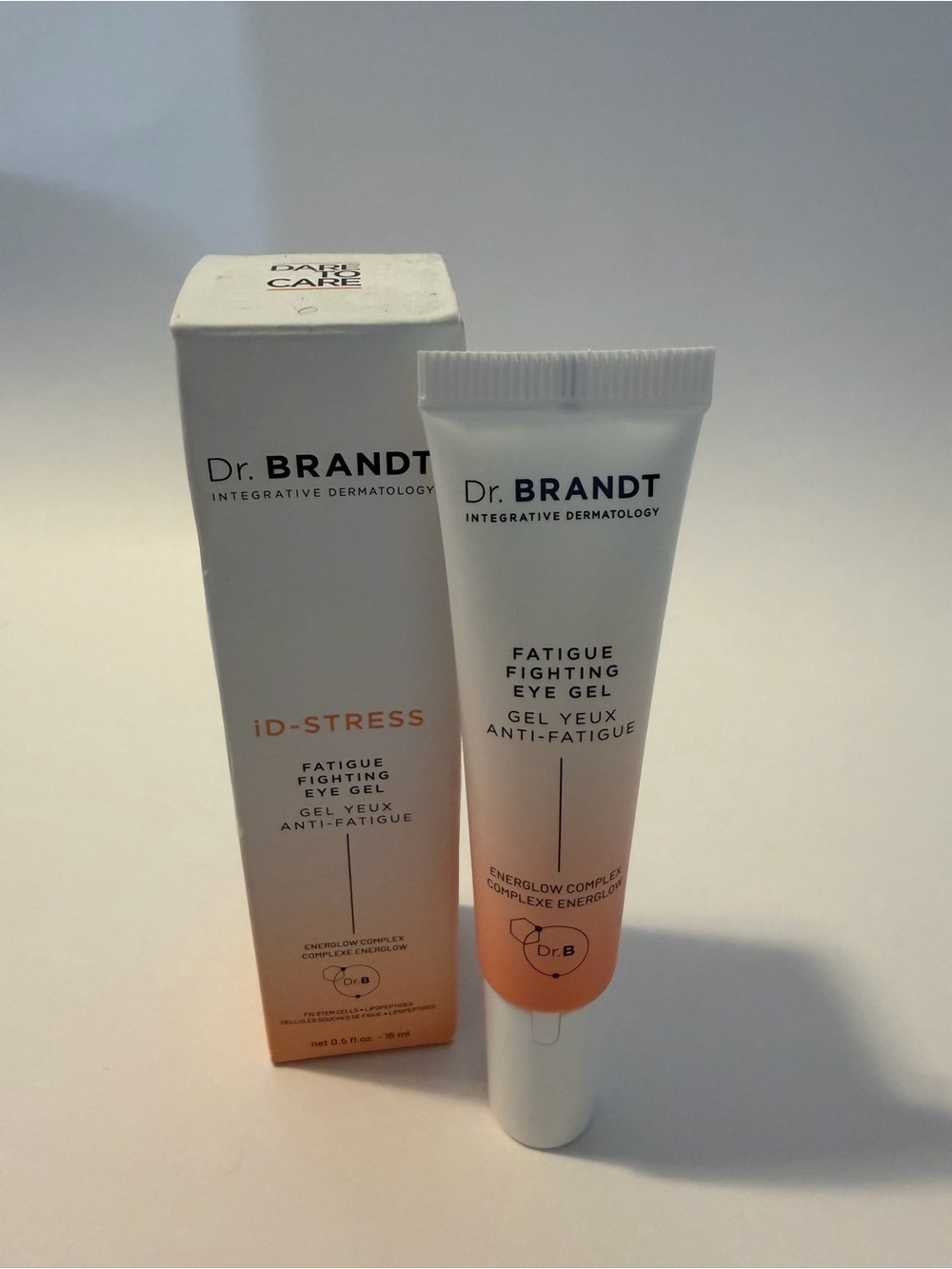 Dr. Brandt Fatigue Fighting Eye Gel — White & Peach Gradient